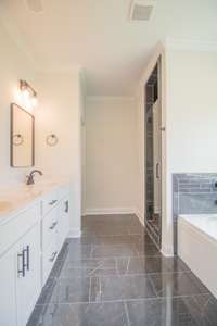 Primary Bathroom Features a Double Vanity, Tile Shower, Garden Tub and Toilet Closet!