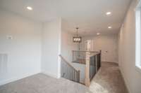Upstairs Foyer Area Features Wrap Around Open Stair Railing!