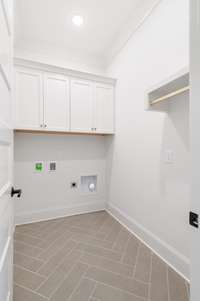 Laundry Room with cabinetry.