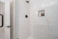 Primary shower with floor to ceiling tile *Photos are for representational purposes only and are of a similar floor plan with differing finishes*