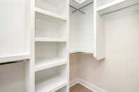 Primary walk-in closet (one of two) *Photos are for representational purposes only and are of a similar floor plan with differing finishes*