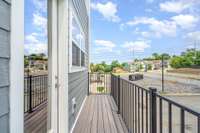 Porch off the kitchen is perfect for morning cup of coffee *Photos are for representational purposes only and are of a similar floor plan with differing finishes*