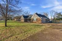 Rocking chair front porch, all brick, large lot size, plenty of driveway parking, AND a two car garage.