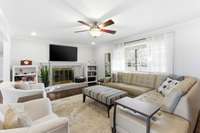 Gorgeous living room, freshly painted light and bright! Laminate flooring throughout the main living areas.  Woodburning FP and large window for natural sunlight.