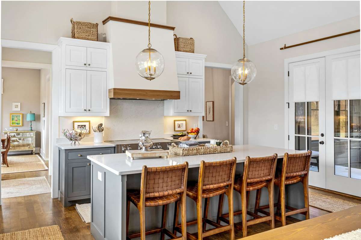 This oversized island, coupled with the large farm table (behind), creates an effortless calm; regardless of the number of people in the home.