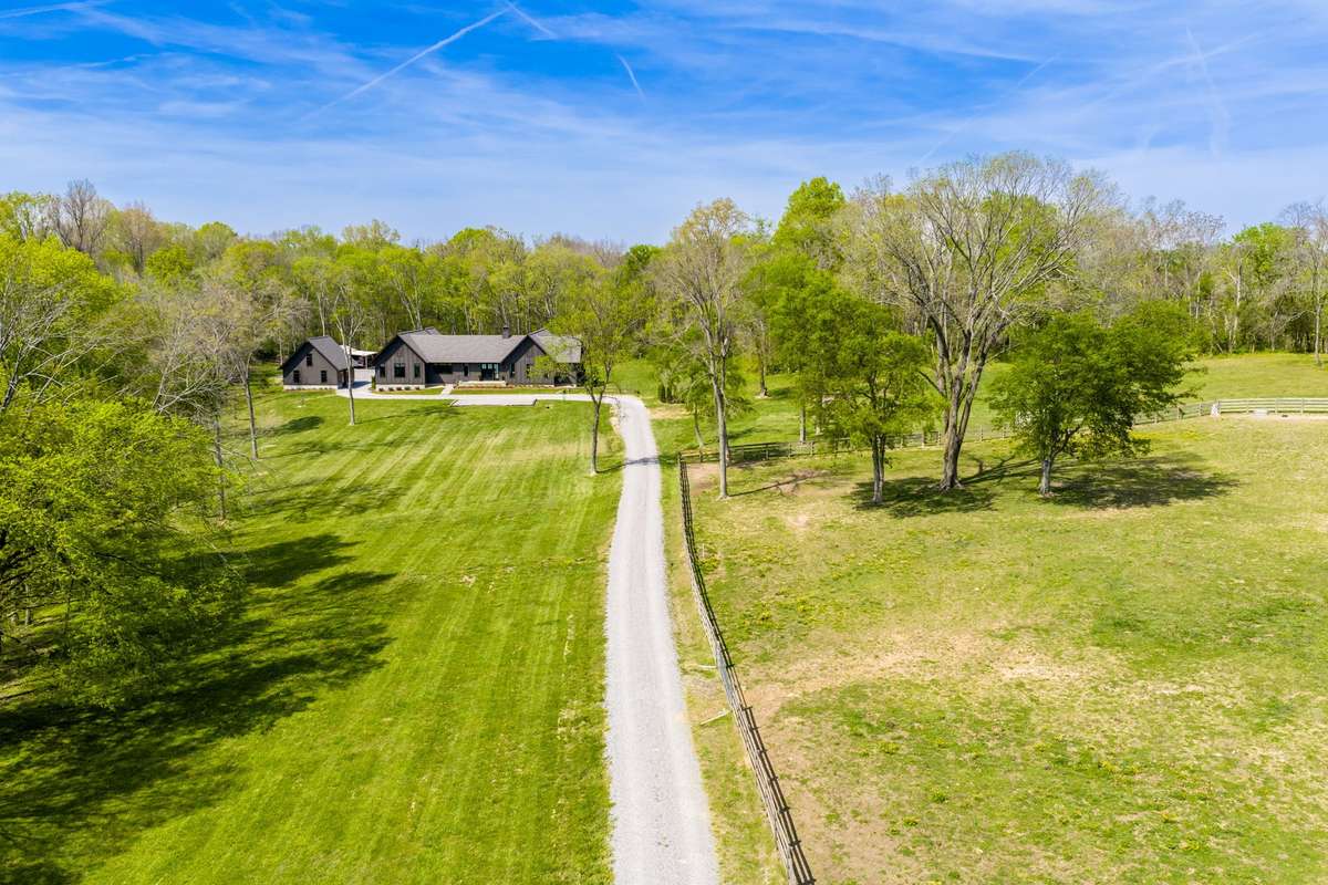 Come along down the long driveway to your private oasis away from the hectic pace. This home backs up to acres of woods.