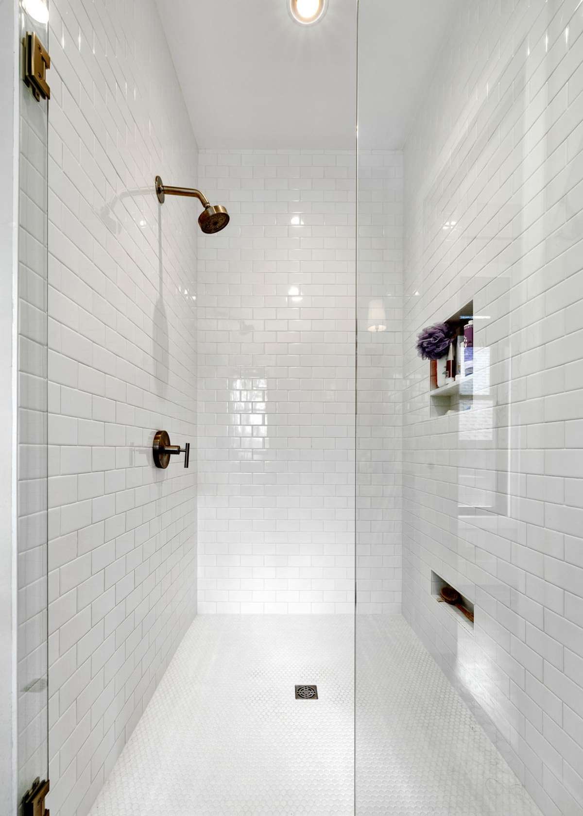 The amazing feature of this shower is the floor to ceiling tile and amazing water pressure!
