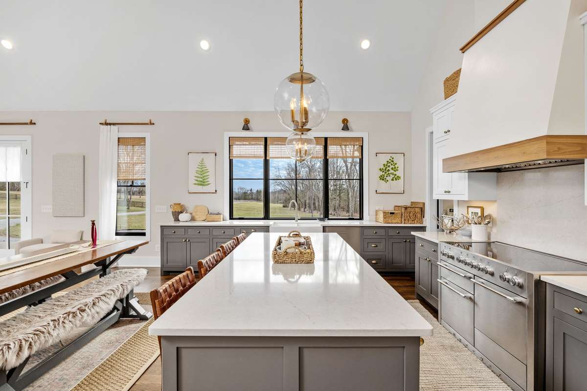 Cathedral ceilings combine with huge windows to create an interior mood that calms your mind and excites your soul!