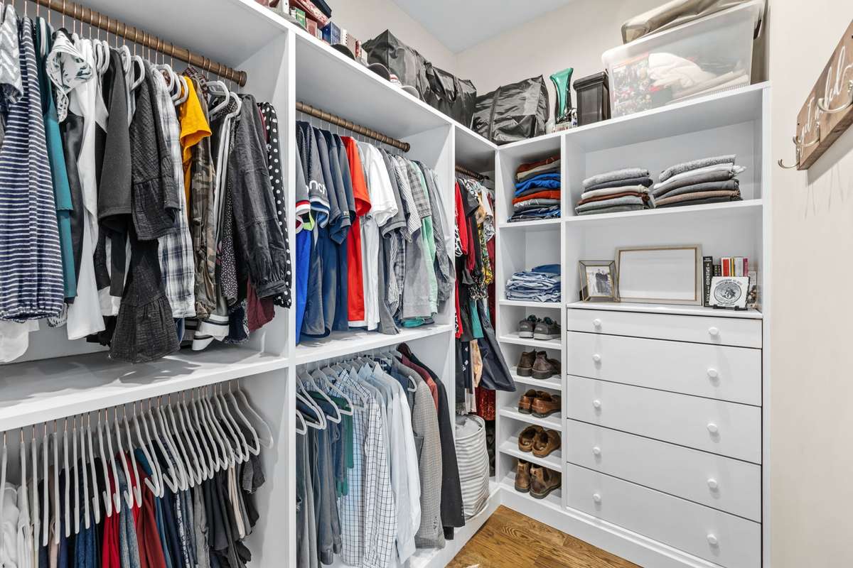 Wonderful hanging rails keep your wardrobe top of mind while cabinetry keeps unmentionables discretely tucked out of site.