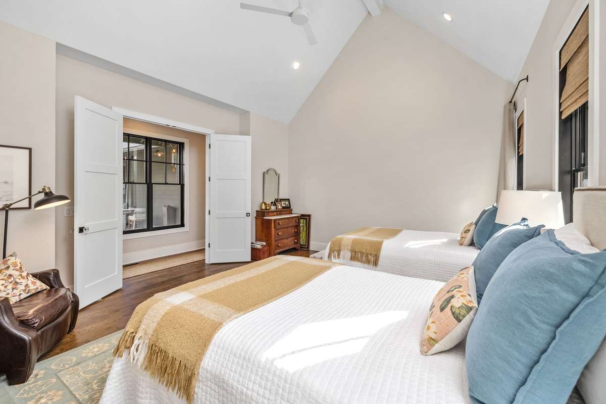 The owner's suite boasts soaring ceilings and private courtyard views.