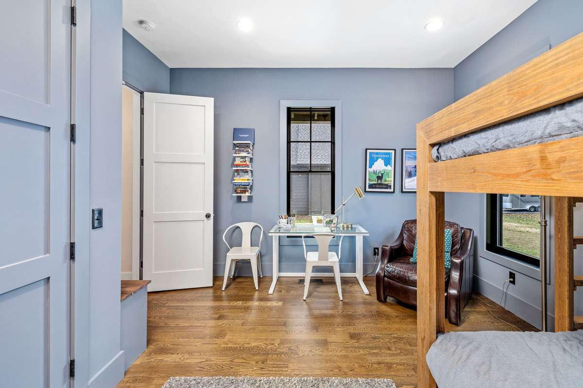 Bedroom 4 is huge with tall ceilings also and an ensuite bath. The closet has built-ins and there is even a bench with storage underneath.