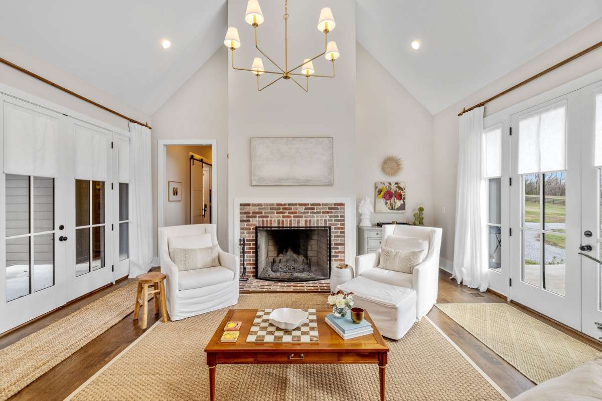 Come back inside, through the courtyard doors (2 sets of French Doors) into the Family Room.