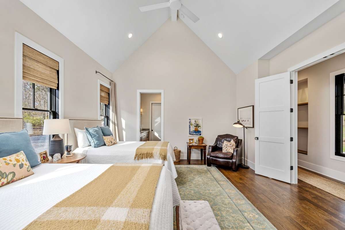 The primary owner's suite is classic with huge windows and sitting area. There is no carpet in the entire home, all hardwood floors and luxury ceramic tile.