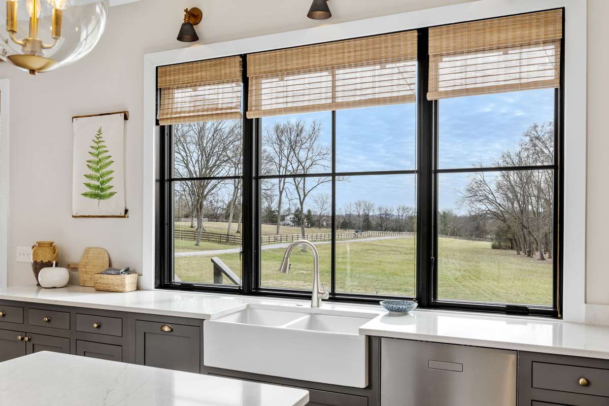 This view transforms you when you are at the house. At the end of this driveway, there is a quiet cul-de-sac with homes on large acreages with horses.