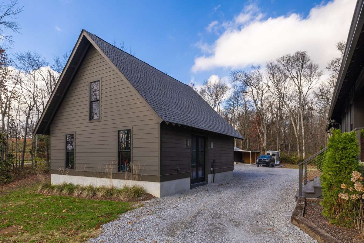 Drive around the driveway to the detached garage, extra-wide turn around pads, and secondary cross tie station.