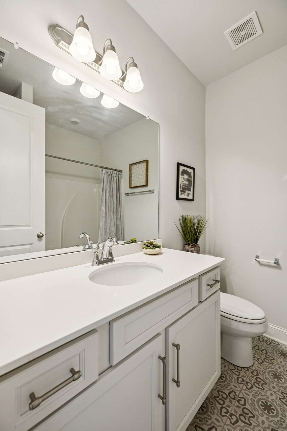 Next to the main floor guest bedroom is a lovely full bathroom.