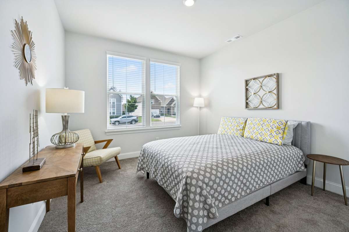 The first of three secondary bedrooms is on the MAIN LEVEL of the home. It features lots of natural light and an oversized closet.