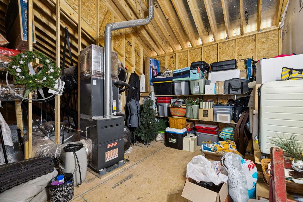 Generous walk in attic storage off the second floor hallway.
