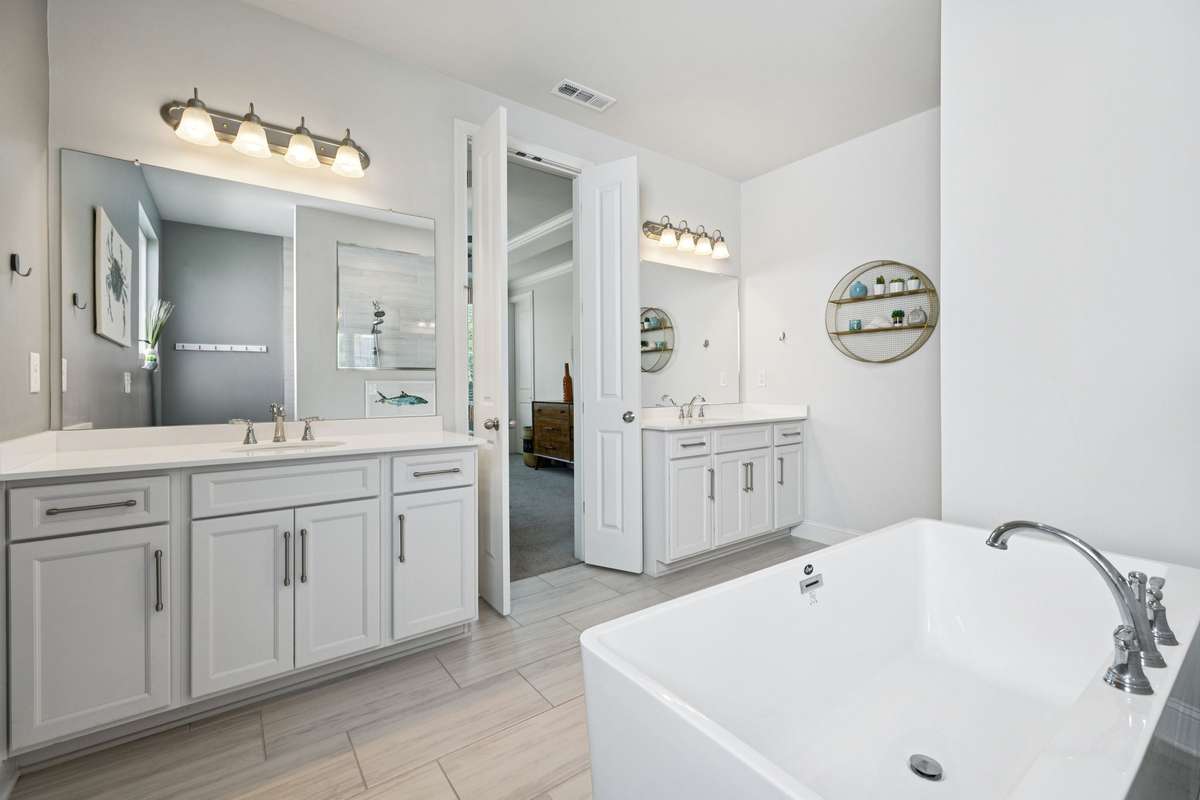 The owner's bathroom room had separate vanity spaces and an oversized soaker tub.