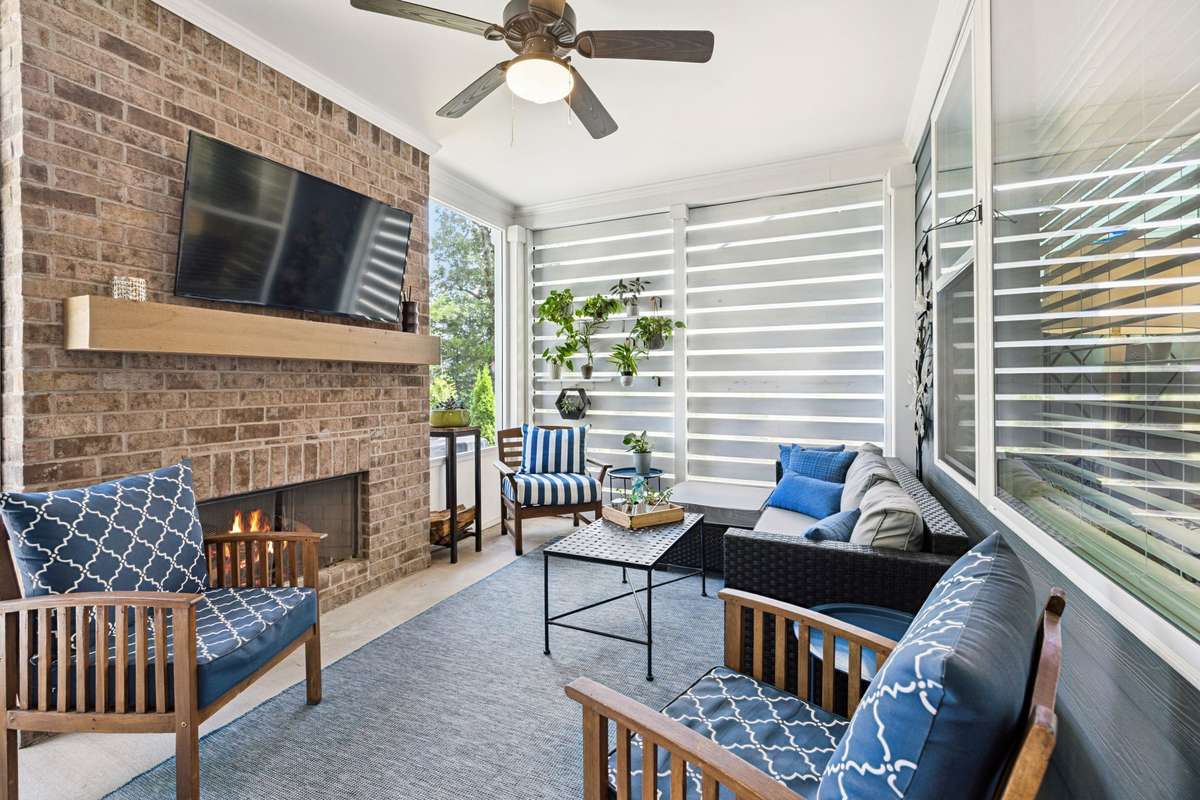 A cozy screened porch sits just off the kitchen/living room.