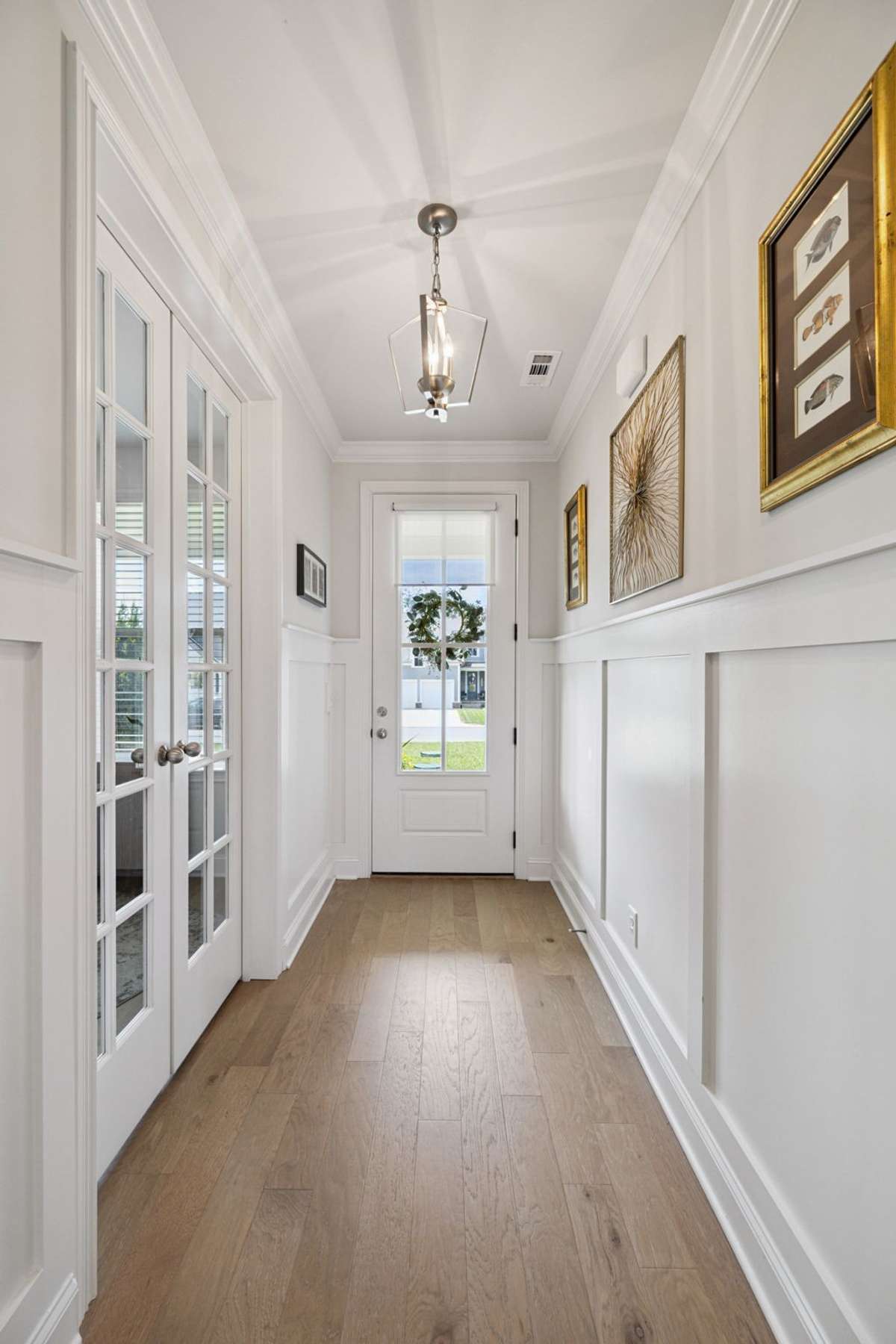 Looking back toward the front door - judges paneling continues through the entry hall.