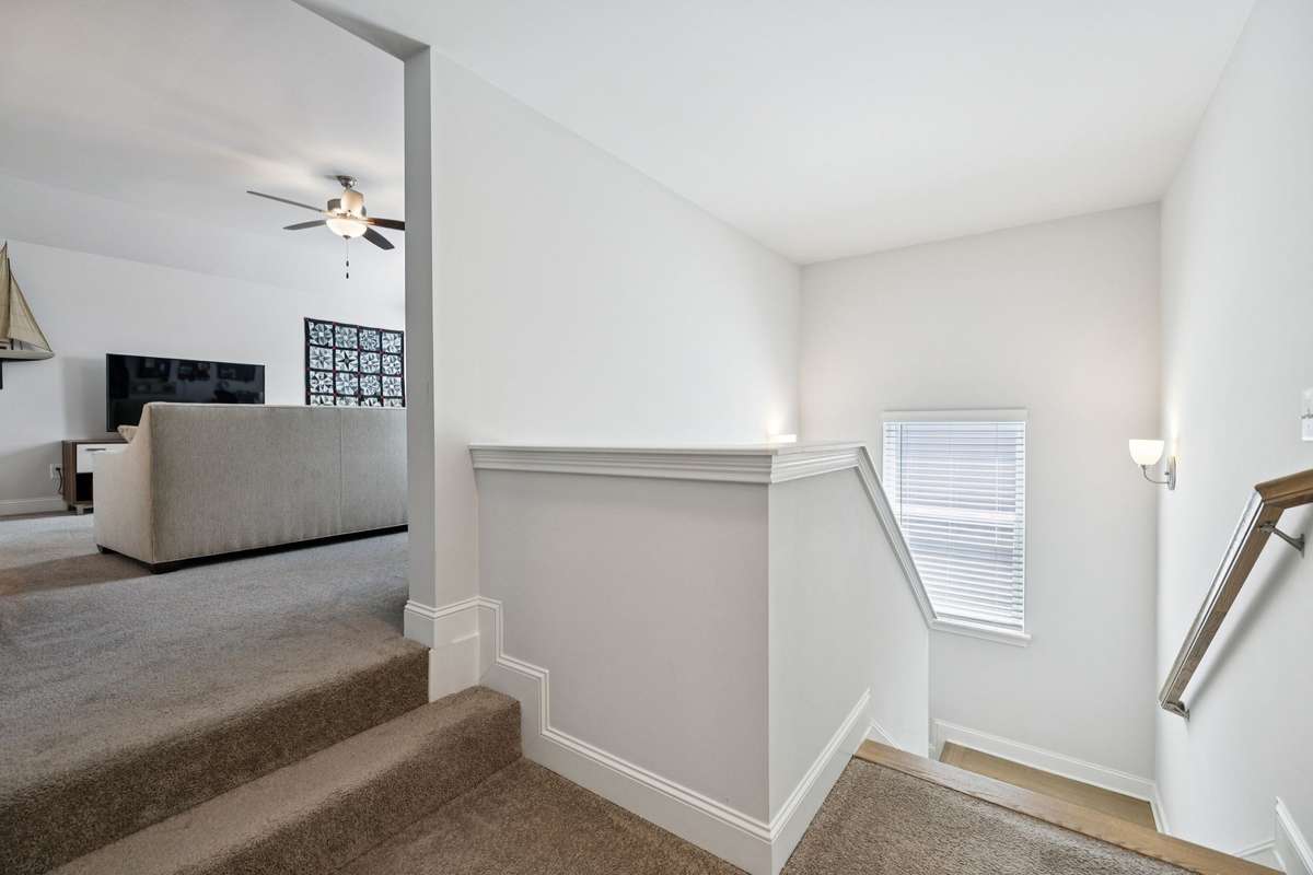 At the top of the stairs, there are two additional bedrooms, a large hall bath and a bonus room.