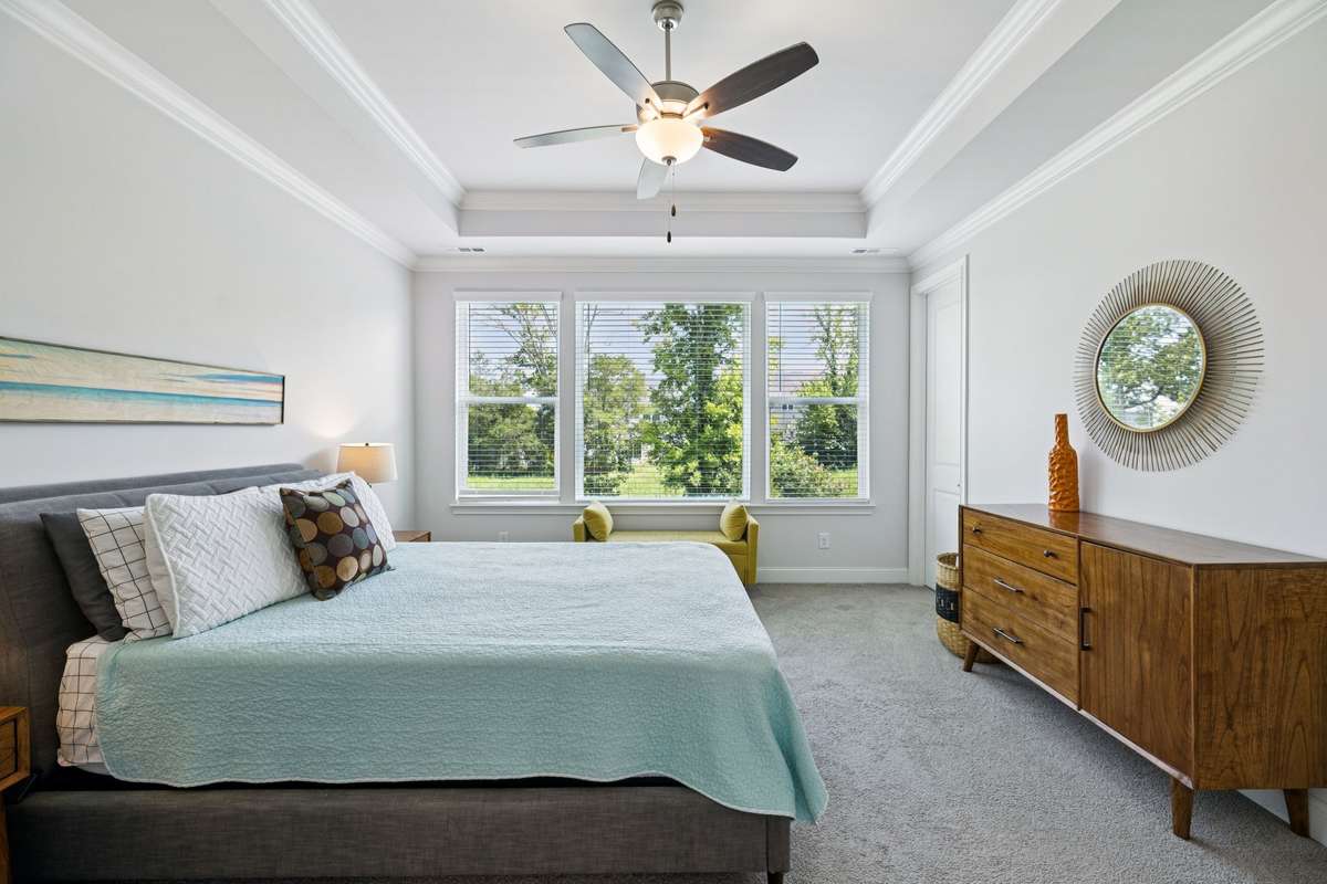 This room features a trey ceiling and views to the back yard.