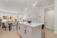 Kitchen island with breakfast bar  *Photos are for representational purposes only and are of a similar floor plan with differing finishes*