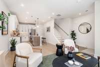 Cozy living space is perfect for nights in or entertaining guests.  *Photos are of a similar floorplan with differing finishes.*