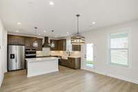 Open concept chefs kitchen! Photos of example home only, build with your design features on your lot!