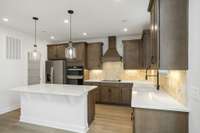 Open concept Chef's kitchen! Photos of example home only, build with your design features on your lot!