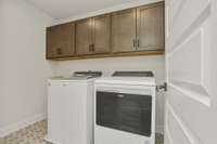 large laundry room! Photos of example home only, build with your design features on your lot!