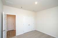 Bedroom 2. Photos not of actual home-but same floorplan-colors may vary.