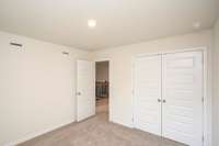 Bedroom 5.  Photos not of actual home-but same floorplan-colors may vary.