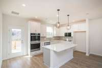 Kitchen. Photos not of actual home-but same floorplan-colors may vary.