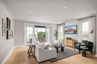 Great room with access to the covered deck *Photos are of a similar floor plan with different finishes and are for representational purposes only*