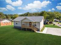 THE SECRET IS OUT...Waverly Tennessee is a TOTAL VIBE!!!
Note: Green Grass Edits on all Exterior Photos