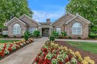 The Clubhouse featuring the library, fitness, and social space with tables and a kitchen for parties or social events