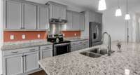 Large granite island for baking, cooking, entertaining, and eating