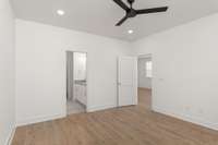 This generous space offers a serene retreat, complete with large windows that flood the room with natural light.