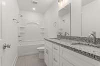 Your hall bath offers the perfect blend of functionality and beauty with these stunning double sinks, designed for convenience and style.