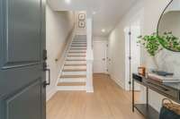 Foyer gives access to the two car garage, lower level bedroom or office and hall closet. *Photos are for representational purposes only and are of a similar floor plan with differing finishes*