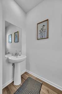 Half bath is conveniently located just before you enter the great room.