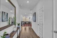 Gorgeous open entryway. Wide enough for shelving to hold some photos and decoration. Entering the home, you will have a door leading to the half bathroom.