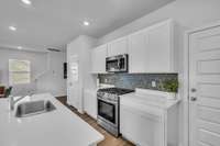 The kitchen features a gas stove and two spacious pantries, offering both convenience and plenty of storage for all your cooking essentials.