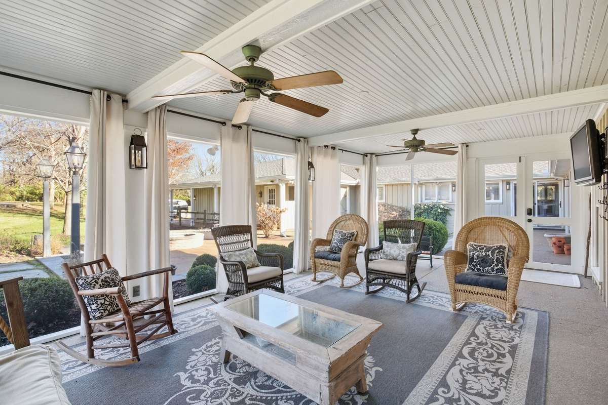 Lovely screened in porch overlooking the sports court and outdoor entertaining areas.