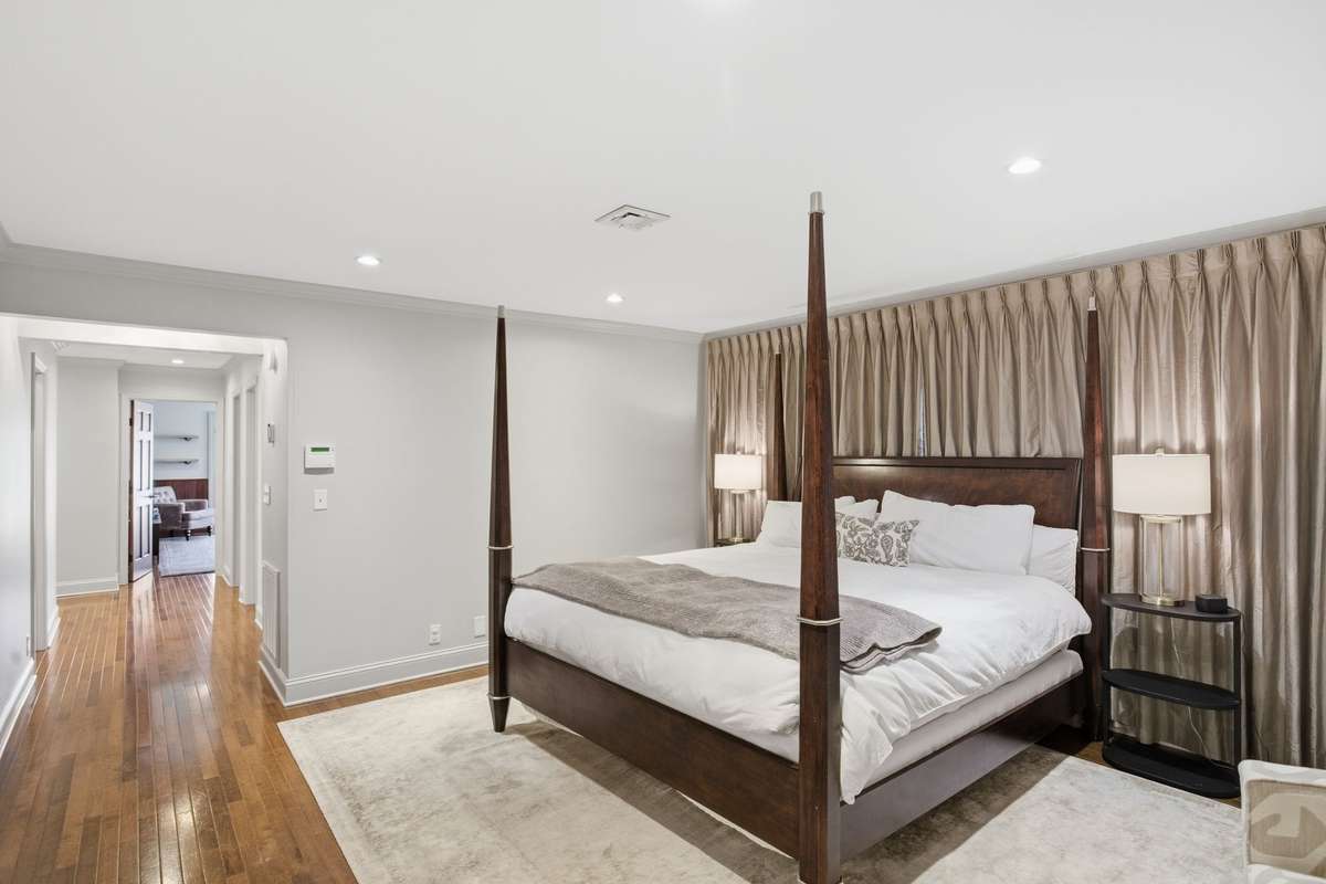 This primary bedroom includes 2 bathrooms, a den, and an office.