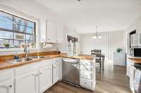 Open sight lines from kitchen to dining, easy flow for everyday living.