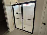 Primary shower with tile surround (not actual home)