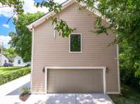 The private alley-access to the 2-car garage of the DADU and the driveway to the back of main home.